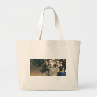 foggy morning sunrise large tote bag