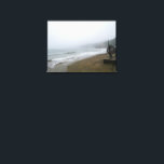 Foggy Scarborough Beach Canvas Print<br><div class="desc">Immerse yourself in the serene, misty beauty of Scarborough's coastline on a foggy day. This atmospheric image captures the calm waves of the North Sea gently rolling onto the unique brick-patterned beach, with the iconic Scarborough hills fading into the distance. Perfect for those who appreciate the moody charm of coastal...</div>