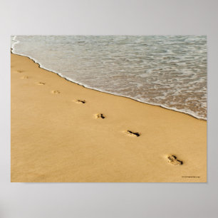 Foot prints in Sand with Wave