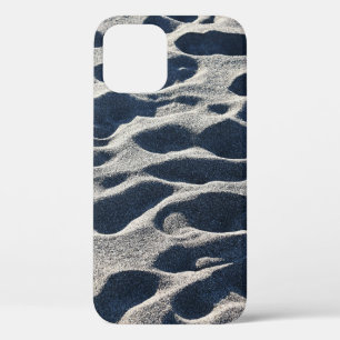 Foot prints on sand during daytime iPhone 12 case