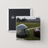Football and football helmet on football field 2 inch square button (Front & Back)