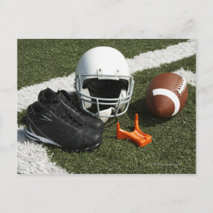 Football, football helmet, tee and shoes on postcard