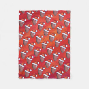 Football in Santa Hat on Red Fleece Blanket