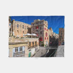 Footbridge, narrow street with stairs in Valletta Fleece Blanket