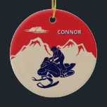 For Snowmobilers Snowmobile Graphic Personalized Ceramic Ornament<br><div class="desc">Create a personalized gift for your favourite snowmobiler. This Christmas tree ornament has a vintage style illustration of a snowmobile and rider in navy blue set against a backdrop of cream or ivory coloured mountains against a red background. It's ready to be personalized with a name in cream and blue...</div>