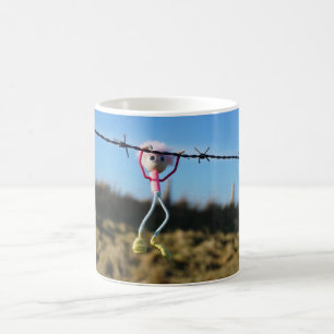 Force Fubby patser to Barbed wire. Coffee Mug