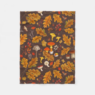 Forest mushrooms and autumn flora on brown fleece blanket