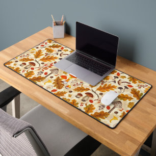 Forest mushrooms and autumn flora on cream desk mat
