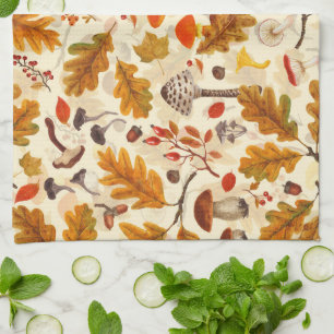 Forest mushrooms and autumn flora on cream kitchen towel
