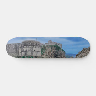 Fortress walls, rocky coast and sea in Croatia Skateboard