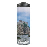 Fortress walls, rocky coast and sea in Croatia