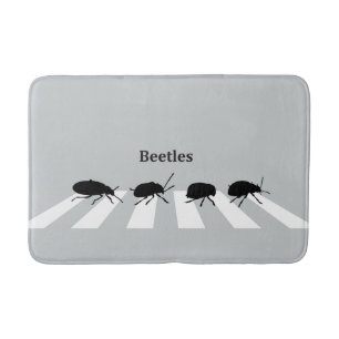 Four beetles walking across a crosswalk in London… Bath Mat