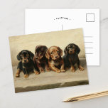 Four Dachshund Puppies | Carl Reichert Postcard<br><div class="desc">Four Dachshund Puppies | Carl Reichert’s Four Dachshund Puppies is an enchanting painting that captures the innocence and charm of four small dachshund puppies. Rendered in neutral earth tones, the artwork highlights their soft fur and expressive faces, showcasing Reichert’s exceptional skill in creating lifelike animal portraits. The harmonious composition and...</div>