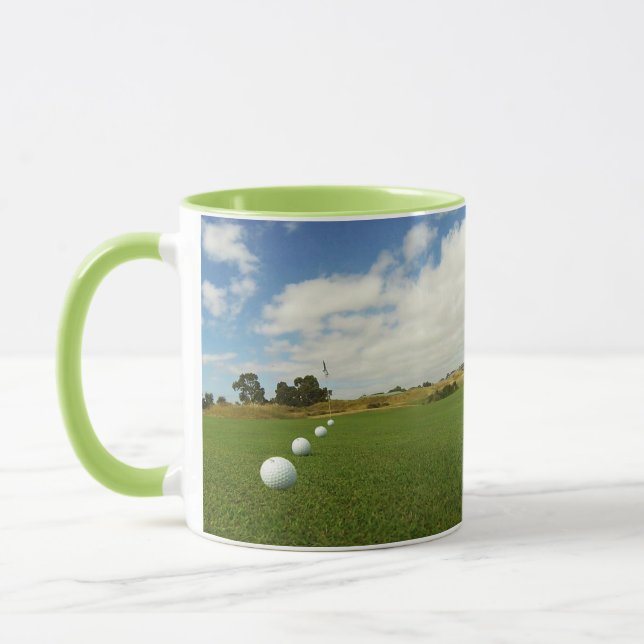 Four Golf Balls Lined Up In Front Of Flag, Mug (Left)