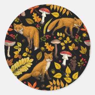 Foxes and buttercups on black classic round sticker