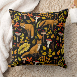 Foxes and buttercups on black throw pillow