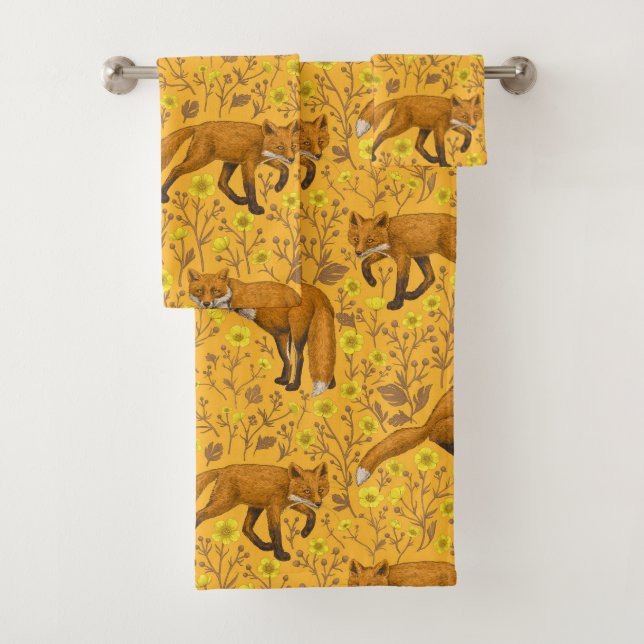 Foxes and buttercups on orange bath towel set (Insitu)