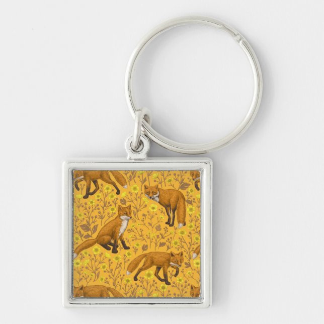 Foxes and buttercups on orange keychain (Front)
