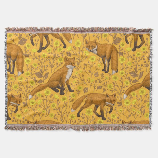 Foxes and buttercups on orange throw blanket (Front)
