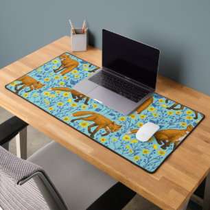 Foxes and buttercups on pool blue desk mat