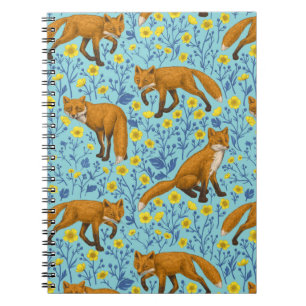 Foxes and buttercups on pool blue notebook