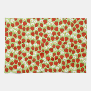 Fraises rouges et fleurs avec serviette de thé ver