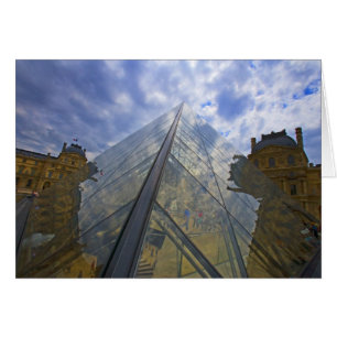 France, Paris. Clouds reflect off the Louvre