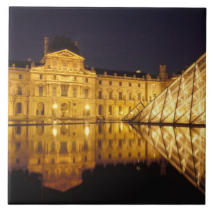 France, Paris, Louvre museum by night. Tile