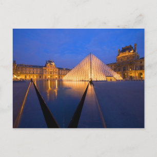France, Paris. The Louvre museum at twilight. Postcard