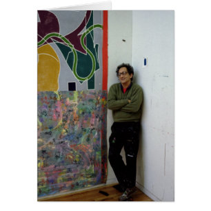 Frank Stella beside one of his works