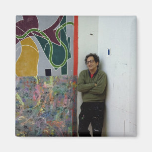 Frank Stella  beside one of his works Magnet