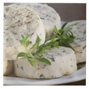 French goat cheese - chevre - with herbs on a tile