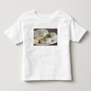 French goat cheese - chevre - with herbs on a toddler t-shirt