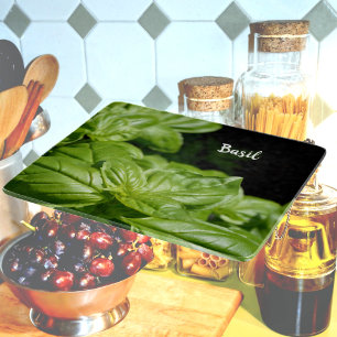 Fresh Green Basil on Black glass Cutting Board