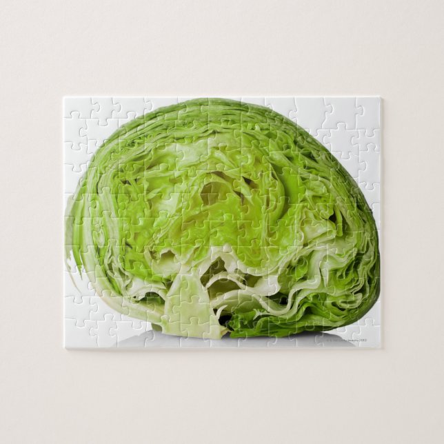 Fresh iceberg lettuce cut in half, on white jigsaw puzzle (Horizontal)