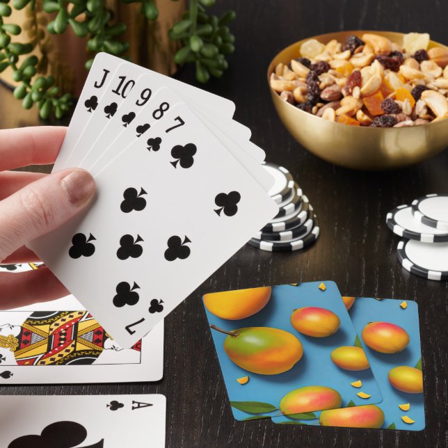 Fresh mangoes on blue playing cards (In Situ)
