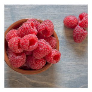 Fresh raspberries in a bowl poster
