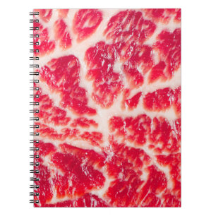 Fresh raw beef steak marbled meat texture close up notebook