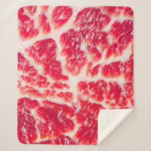 Fresh raw beef steak marbled meat texture close up sherpa blanket