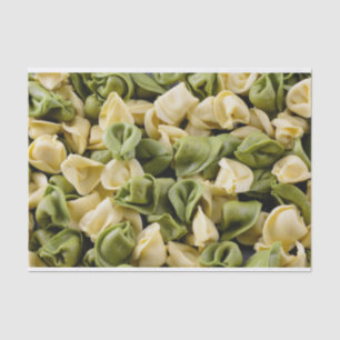 Fresh raw tortellini pasta tissue paper