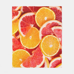 Fresh ripe orange and grapefruit backgroundbackgro fleece blanket