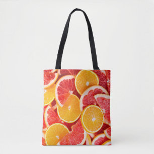 Fresh ripe orange and grapefruit backgroundbackgro tote bag