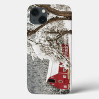 Fresh snow on red barn
