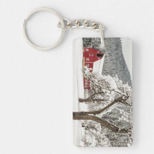 Fresh snow on red barn keychain