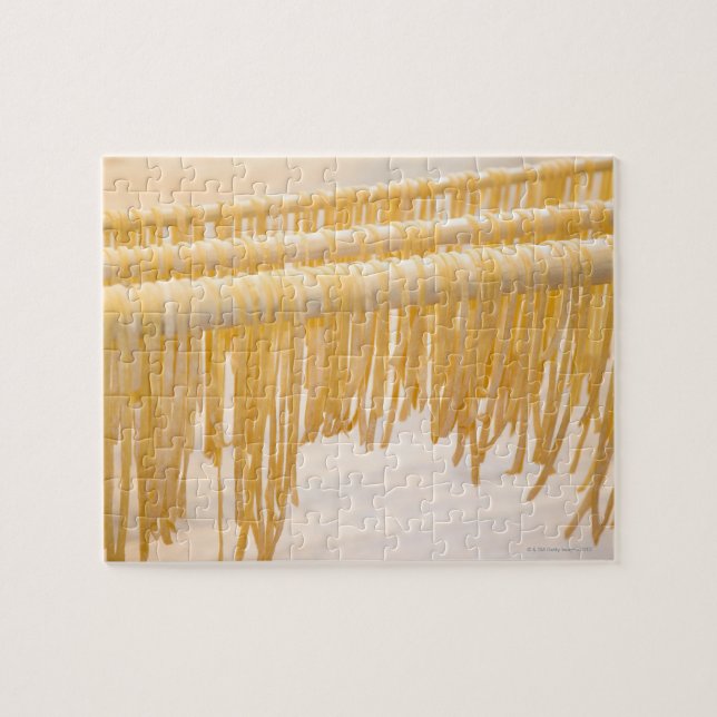 Freshly made pasta drying on a wooden rack jigsaw puzzle (Horizontal)