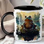 Frog on Rock Forest Mug<br><div class="desc">Delight in the whimsical charm of the Frog on Rock Forest Mug. This unique mug features a vibrant image of a frog perched on a rock in a lush forest setting, with the morning light filtering through the trees. Customized with your name, it adds a personal and playful touch. Perfect...</div>
