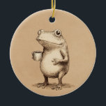 Frog with Coffee – Whimsical Vintage Animal Ceramic Ornament<br><div class="desc">A charming and slightly quirky illustration of a frog holding a cup of coffee, captured in a vintage engraving style. The detailed linework and warm neutral tones give this character a timeless, artistic feel, while the simple concept adds a touch of humor and personality. Perfect for coffee lovers, animal art...</div>
