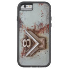 From classic car: Rusty old v8 emblem in chrome