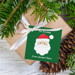 From Santa Claus Cute Custom Green Kids Christmas Favour Tags<br><div class="desc">Customize these cute Santa Claus gift tags with your own personalized text with your kids name in white script. Santa's red hat and white beard are the perfect holiday drawing on this pretty green gift tag for your presents.</div>