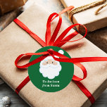 From Santa Cute Custom Green Kids Christmas Gift Favour Tags<br><div class="desc">Customize these cute Santa Claus round gift tags with your own personalized text with your kids name in white script. Santa's red hat and white beard are the perfect holiday drawing on this pretty green gift tag for your presents.</div>